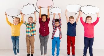 childrens-holding-chat-bubbles_23-2148445739